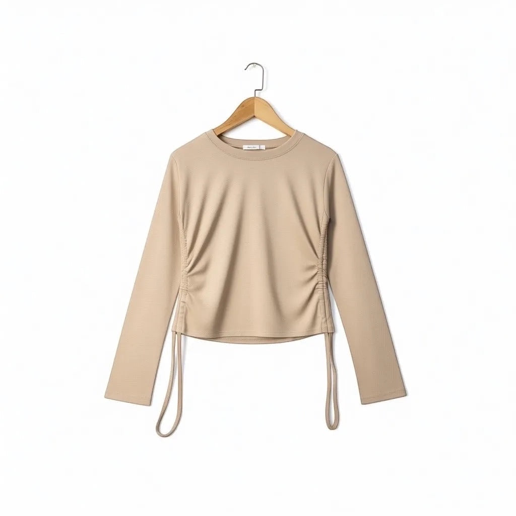 JJACollection beige long sleeve top with adjustable side ruching and drawstrings for a customizable fit.
