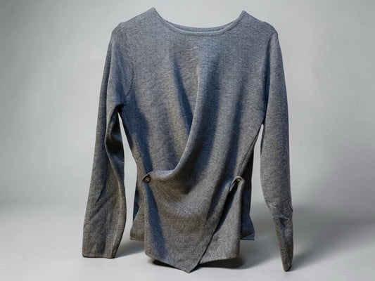 JJACollection grey knit long sleeve asymmetrical wrap top with button detail.